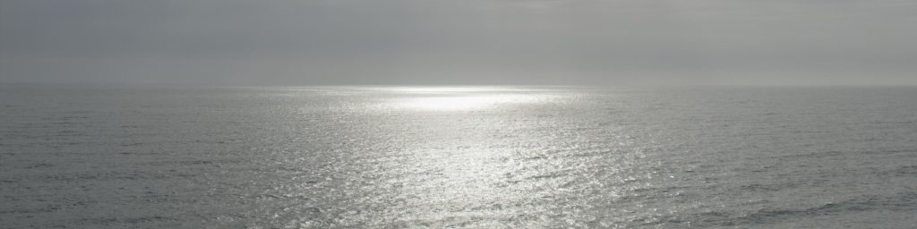 Sun reflecting on silver sea